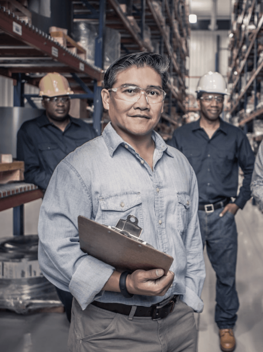 Three men in warehouse